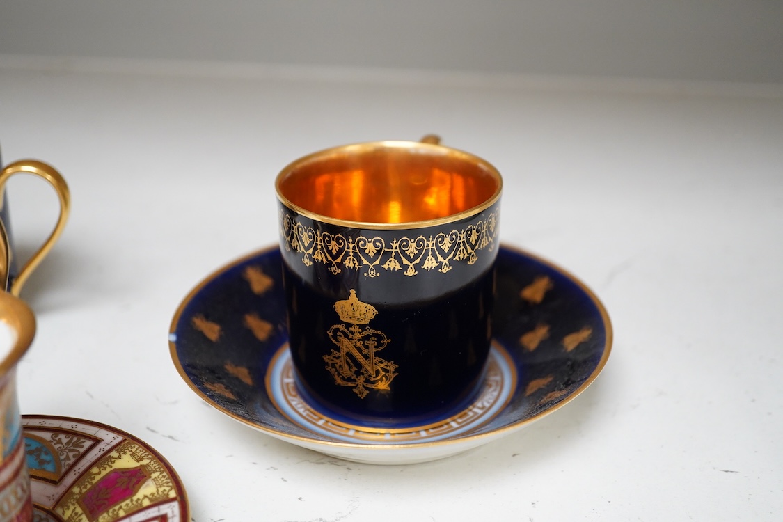 A 19th century Sevres style Napoleon cup, together with a similar cup and saucer and a Naples cup and saucer, cup 8cm from top of handle to base.